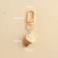Pastel pink resin ice cream keychain with dimensions and lobster clasp for bag decoration - Brown