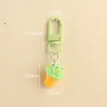 Mint green resin ice cream keychain with matching metal lobster clasp and size dimensions - Green