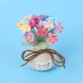 Handmade crochet flower bouquet with a beige base and colorful knitted blossoms - Multicolor-Forget-Me-Not Potted (Small Yarn Vase)