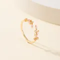 Adjustable gold leaf ring featuring pink marquise-cut stones and a micro-pave leaf design - Gold with Pink Gemstone