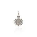 Silver sun pendant with zirconia stones on white background with reflective surface - Platinum