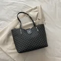 Large black tote bag with grey M-letter monogram print and silver hardware details - Black