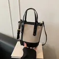 Sac seau bicolore en toile beige et cuir noir pour femme, idéal pour le travail quotidien - Noir
