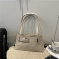 Chic beige suede underarm bag with decorative belt buckle and dual shoulder straps - Khaki