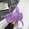 Glossy purple PVC jelly boston bag with gold hardware and removable shoulder strap - Purple