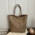 Brown woven tote bag with embossed texture and double handles for daily commute - Khaki