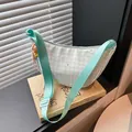 Mint green checkered crossbody bag with colorful star prints and a wide fabric strap - Green