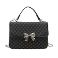 Black square shoulder bag with four-leaf clover print and silver metal bow detail - Black Monogram