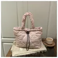 Light pink heart-quilted puffer tote bag with black and white drawstring closure - Pink