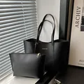 Vintage black leather tote bag set for women with matching zipper clutch and gold lettering - Black