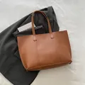 Brown large capacity commuter tote bag with vertical stitching and long shoulder straps - Brown