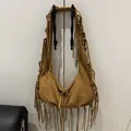 Bohemian style tan brown suede hobo bag with long fringe tassels for casual wear - One Size / Brown