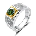 Macro detail of men's 925 silver ring with green moissanite and gold plated setting - Size 7 / Dark Green Moissanite