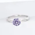 Elegant S925 silver ring featuring a 1-carat round purple moissanite in six-prong setting - Light Purple