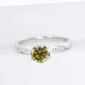 S925 sterling silver ring featuring a round cut yellow-green moissanite center stone - Yellow-Green