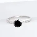 Elegant S925 silver ring featuring a round black moissanite stone in 6-prong setting - Black