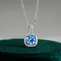S925 sterling silver necklace featuring a round blue moissanite pendant with halo diamonds - Sapphire Blue