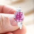 Detail of s925 silver ring featuring a 3-carat pink round stone and side pear diamonds - US 5 / Pink