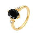 Macro shot of 18K gold ring featuring an oval black gemstone and sparkling side stones - Black