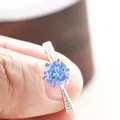 Detail of a 925 silver ring featuring a blue round-cut moissanite in a six-prong setting - HK Size 15 / 1 Carat Royal Blue