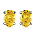 Detalle de pendientes de moissanita amarilla ovalada con engaste de cuatro garras - Amarillo Dorado