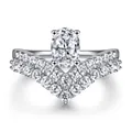 Macro shot of V-shaped double-row pavé band with a 1-carat oval-cut moissanite stone - US Size 5 / Oval Main Stone with V-Shaped Band Set