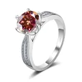 Close-up of champagne round cut moissanite ring with six-prong silver setting - Size 5 / Lucky Red (3 Carat)