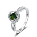 Macro shot of S925 silver ring featuring a green moissanite with twisted pavé band - HK Size 10 / Teal