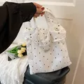 White pleated tote bag with black floral pattern and fashion label for women - White