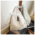 Off-white canvas beach tote bag featuring floral lace splicing and a bow strap detail - Cream With White Satin Ribbon