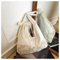 Cream canvas tote bag with floral lace embroidery and a decorative ribbon bow - White With Khaki Scarf