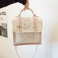 Cremeweiße Handtasche mit rosa Tiermotiven und abnehmbarem Schultergurt - Rosa