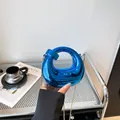 Metallic blue crescent bag with knot handle and gold chain for women in 2025 fashion - Spiral Circular Style (6153) / Blue
