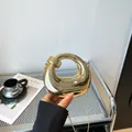 Glossy gold hollow circular evening clutch bag with chain strap and mirror finish metal - Spiral Circular Style (6153) / Gold