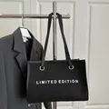 Black canvas tote bag with Limited Edition print and silver eyelets for women - Black