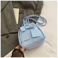 Mini light blue PU leather backpack with a large decorative bow and adjustable straps - Blue