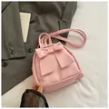 Mini light pink backpack with large leather bow detail and versatile carry straps - Pink