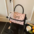 Pink bow handbag with black heart pattern and pearl lace charm in variant color - Heart Printed / Single Bag