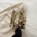 Elegante gouden emmertas met grote pailletten en een bijpassende ketting schouderriem - Goud