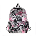 Student backpack with graffiti art print in pink and black featuring an astronaut charm - Pink