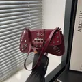 Punk style wine red patent leather shoulder bag with silver studs and metal buckles - Burgundy