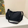 Minimalist black large capacity crossbody bag with adjustable wide strap and side pockets - Black