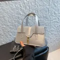 Silver metallic crossbody bag with glitter detail and golden clasp for women - Silver