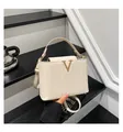 Cream woven shoulder bag with gold V-buckle accent and adjustable strap for women - White