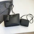 Three-piece black lychee textured leather tote bag set with crossbody bag and charm - Black