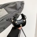 Chic black mini half-moon leather bag with large silver studs and top handle - Black