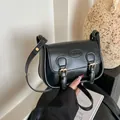 Retro black PU leather saddle crossbody bag with gold buckles and fashion embossing - Black