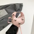 Pink crescent shoulder bag with silver spherical studs and an adjustable strap - Pink