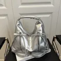 Silver metallic PU hobo bag featuring dual zippers with chic ribbon bows - Silver