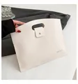 Waterproof off-white lychee grain leather laptop tote bag with handle and metal buckle - White